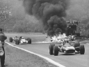 [thumbnail of 1968 french gp - jacky ickx (ferrari), john surtees (honda) pass jo schlesser's burning honda.jpg]